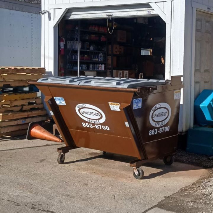 1 yard dumpster with Wood County Waste Logo on it